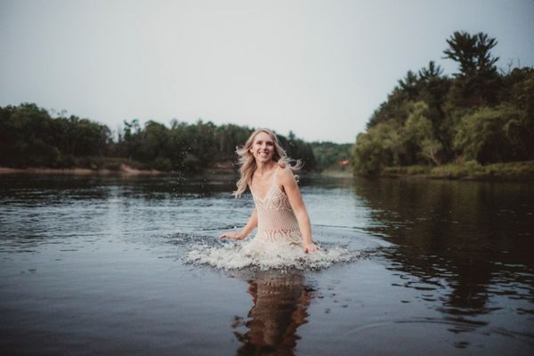 caroline weiss in a white dress in the water